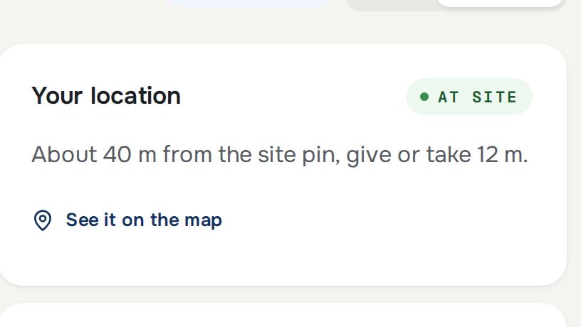 A check-in screen reading the supervisor's location: at site, about 40 m from the site pin, give or take 12 m.